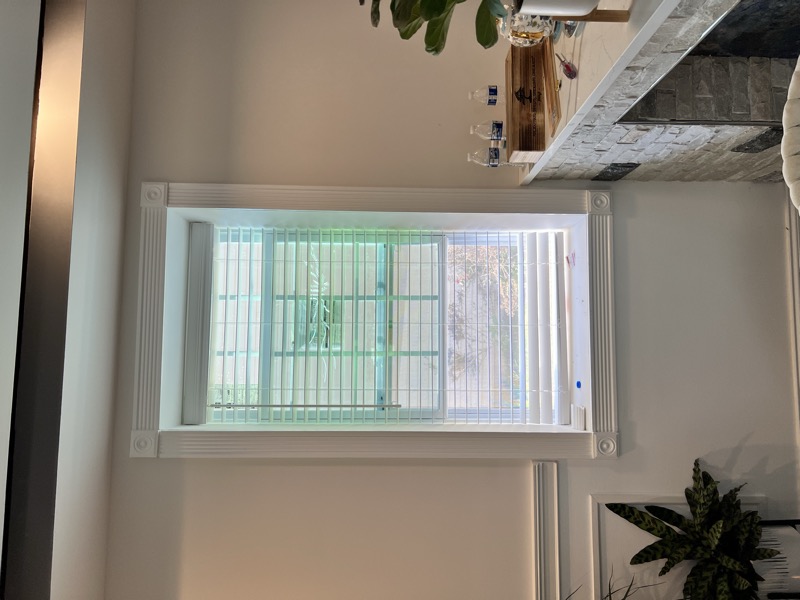 blinds next to fireplace in living room