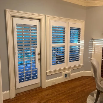 Custom plantation shutters installed in Sugar Hill home living room